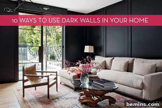 A sophisticated living room featuring dark black walls, a luxurious beige sofa set, a rustic wooden coffee table adorned with a decorative vase, and elegant lighting fixtures.