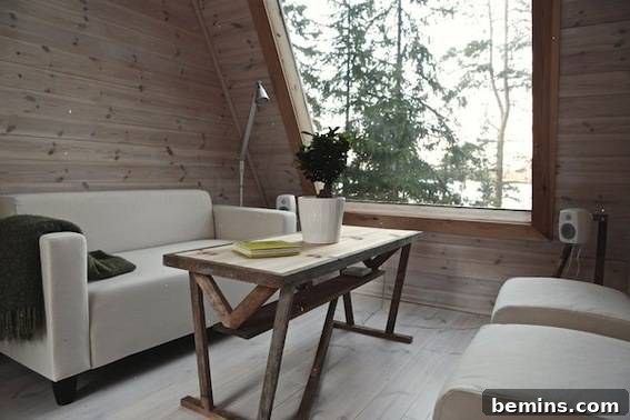 Eye Candy: 11 Tiny Homes That Will Steal Your Heart 22 White sofa in front of a table in a cabin