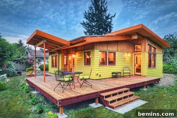 Eye Candy: 11 Tiny Homes That Will Steal Your Heart 5 Yellow house with a wooden deck