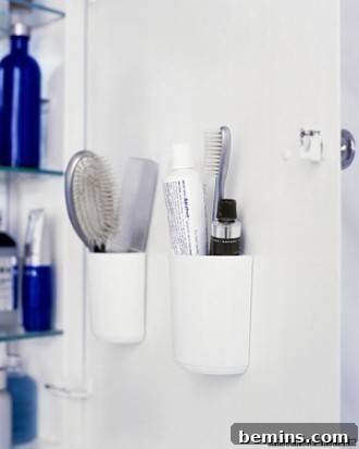Shampoos and brush are in the bathroom, demonstrating cabinet door storage solutions.