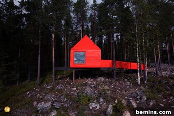A unique floating red cabin in the woods, showcasing an unconventional application of red in architecture