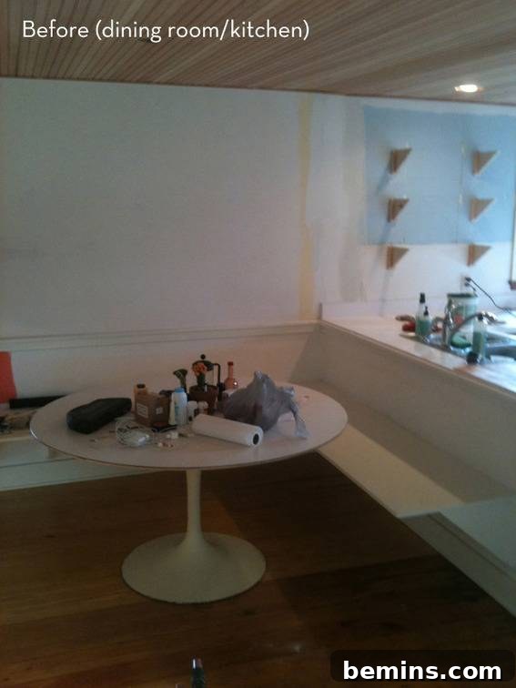 The 'before' image of the kitchen and dining room area, showcasing the original layout and condition of the space.