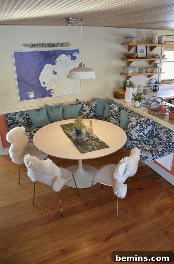 The finished dining room and kitchen in the renovated coastal cottage, showcasing a seamless and stylish design.