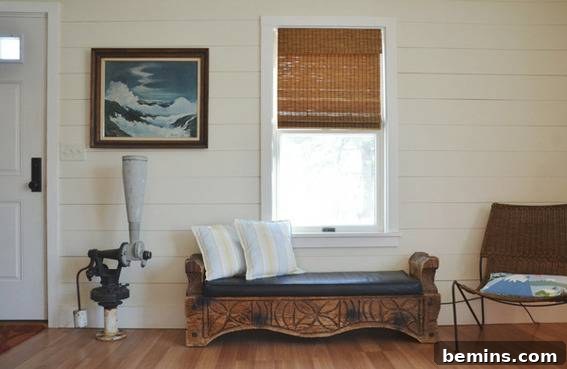 The entryway of the renovated coastal cottage, showcasing a welcoming and stylish design.