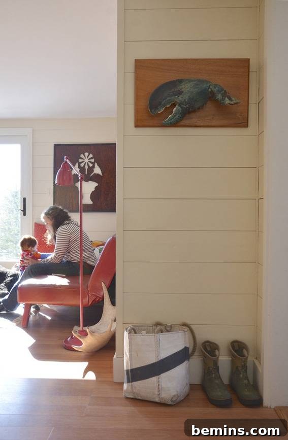 The casual front room of the renovated coastal cottage, exuding a comfortable and inviting atmosphere.