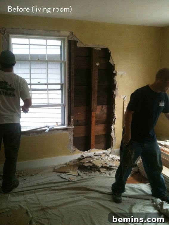 Before and after: Two men are involved in the demolition process of the living room, preparing for the coastal cottage renovation.