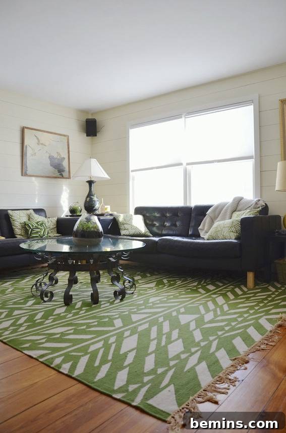 The beautifully finished living room of the renovated coastal cottage, showcasing a bright and airy design.