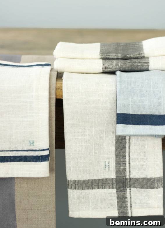 Linen cloths with grey and blue dyes and an H imprinted on them