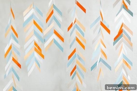 Decorations are made out of orange, blue and white papers.