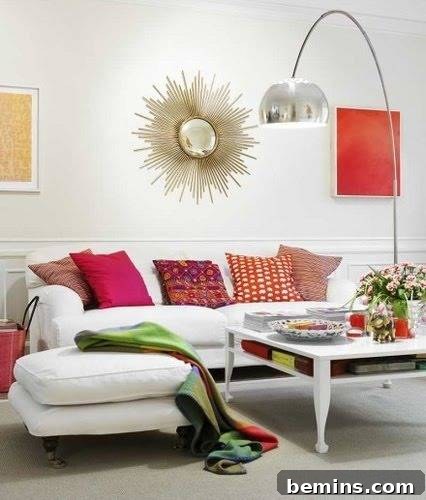 Couch with colorful throw pillows, flowers, and books on a white coffee table