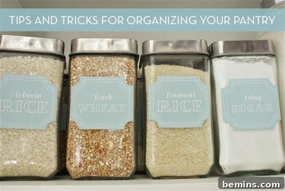 Organized pantry with labeled bins - a stylish pantry makeover.