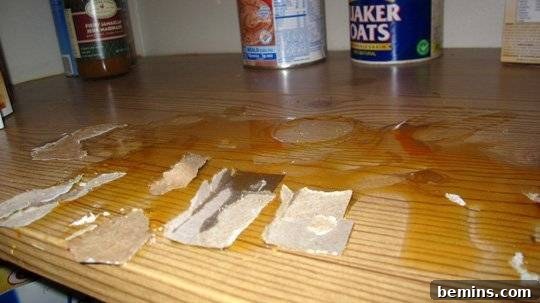Sticky spill on a pantry shelf needing cleaning.