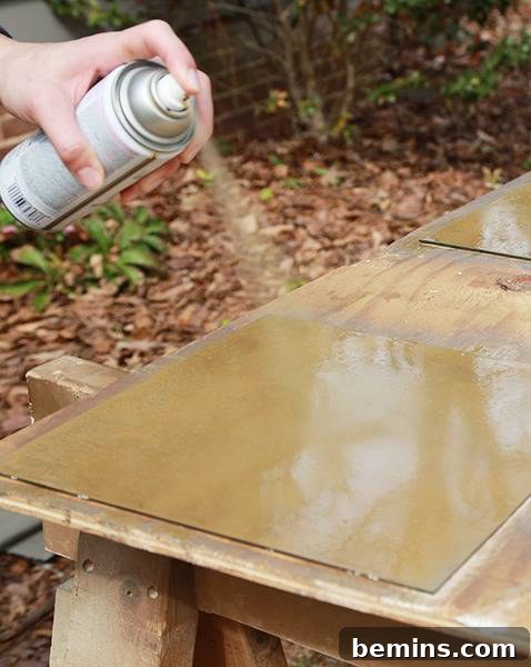 Craft Your Reflection: A DIY Antique Mirror Project 9 Applying Gold Spray Paint to Back of Mirrors