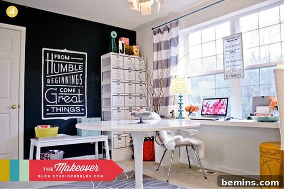 Organized and stylish craft room with a table, quotes, chair, and laptop.