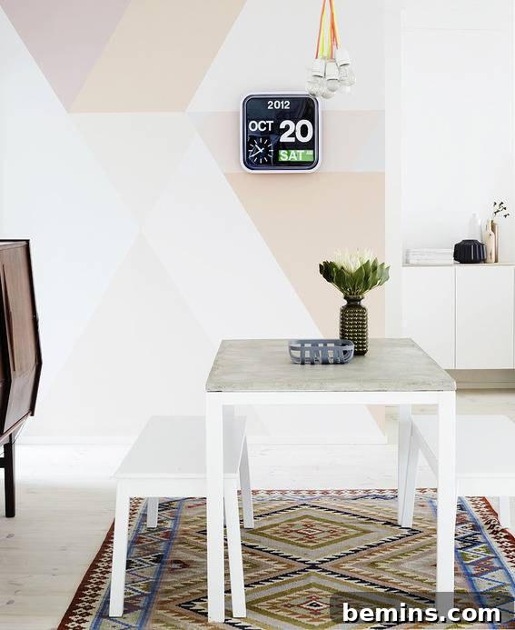 White table with a plant on a designer carpet, and a modern calendar hanging on the wall.
