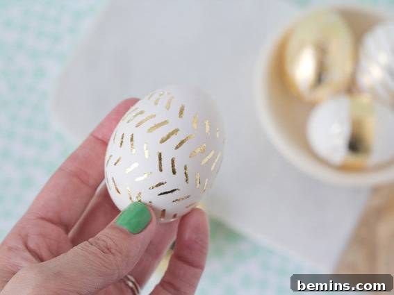 "Designer egg with golden stripes."