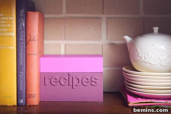 You can organise your kitchen cutlery with books in a same shelf.