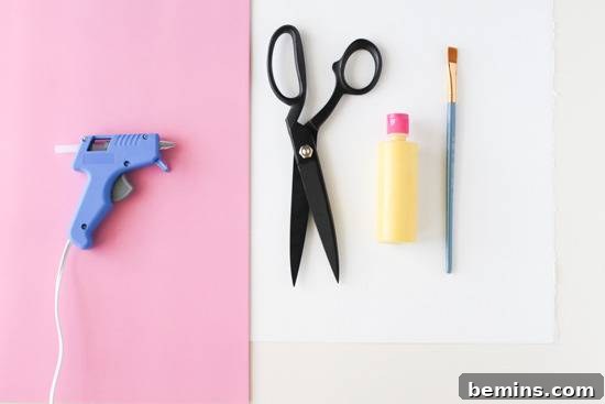 Budget-Friendly Big Art: Creating Large Artworks for Under $10 3 Scissors and craft tools on pink and white backgrounds, ready for a DIY art project