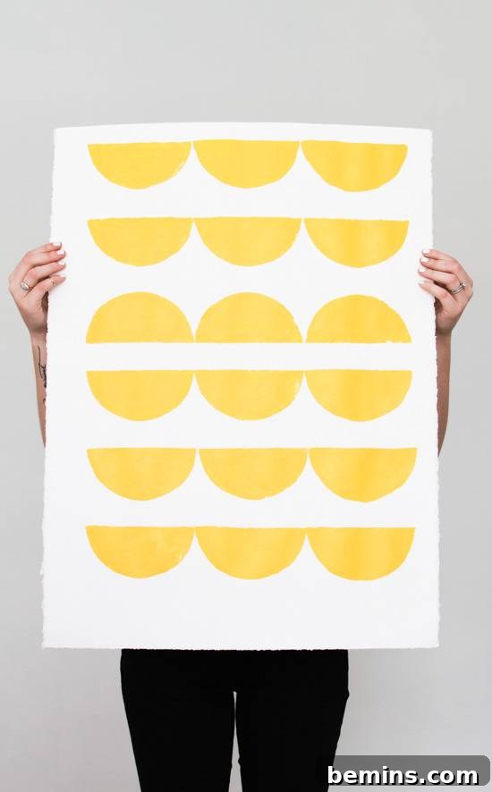 Budget-Friendly Big Art: Creating Large Artworks for Under $10 6 A person holding up a white poster board with yellow dots
