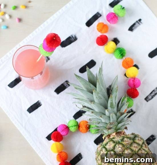 DIY paper honeycomb drink stirrers and garland for a colorful Cinco de Mayo party.