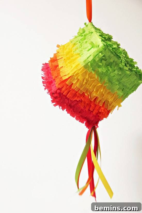 DIY Cinco de Mayo Mini Piñatas made from repurposed tissue boxes.
