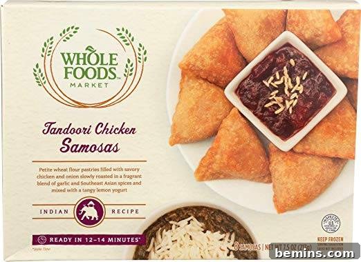 A close-up shot of Whole Foods Tandoori Chicken Samosas, highlighting the golden-brown crust and flavorful filling