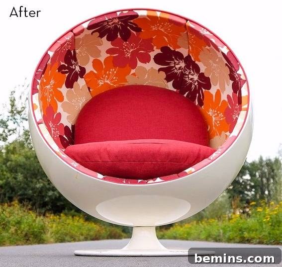 Circular chair with a red cushion and flower decor.