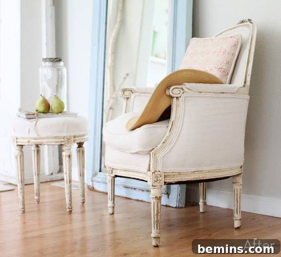 Light-colored chair and ottoman in a room with a light-colored floor.
