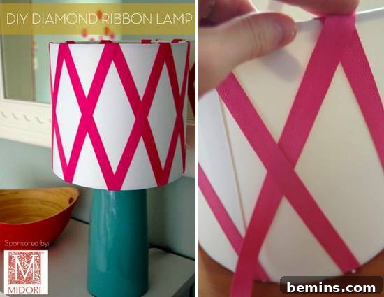 A lampshade decorated with pink ribbon.