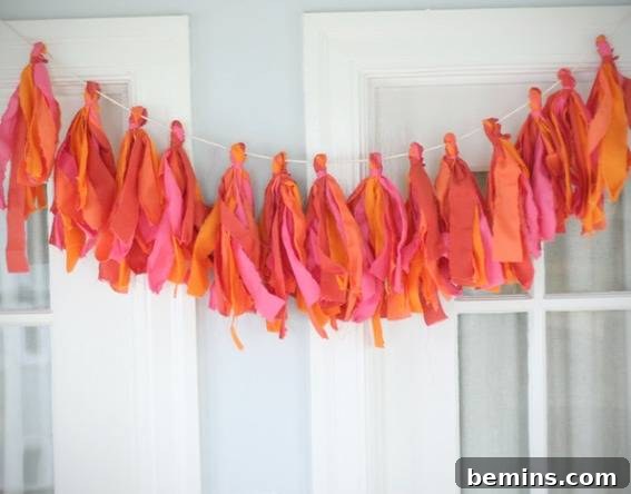 Fabric tassel bunting hanging over a door.