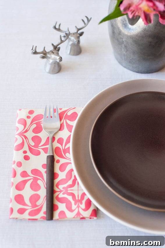 A folded napkin with a floral design.