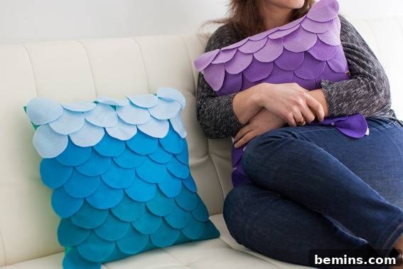 A woman holding a purple scalloped pillow.