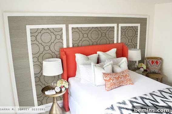 Bed with orange headboard and white covers