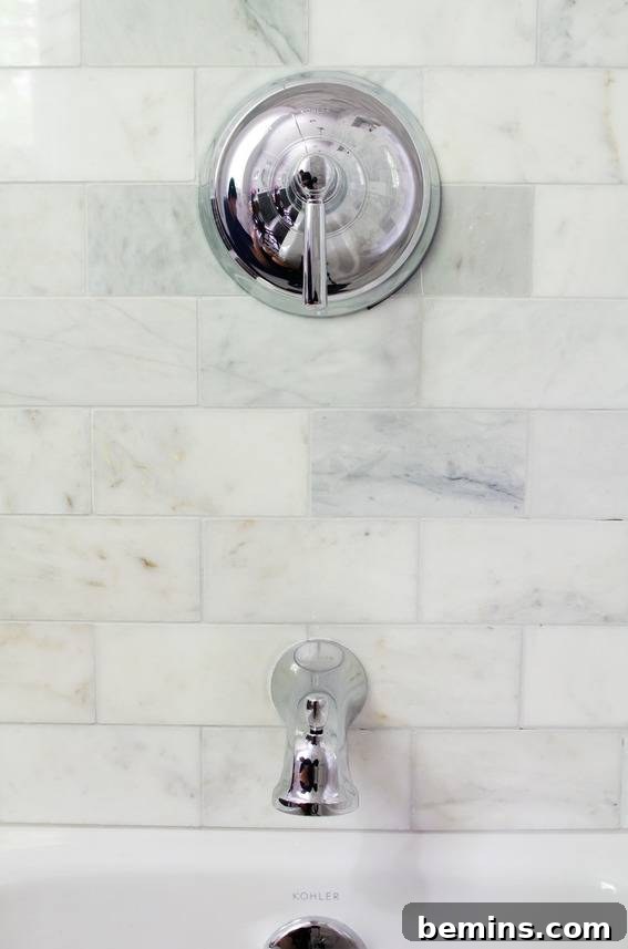 Kohler Bancroft Shower Fixture with Marble Subway Tile