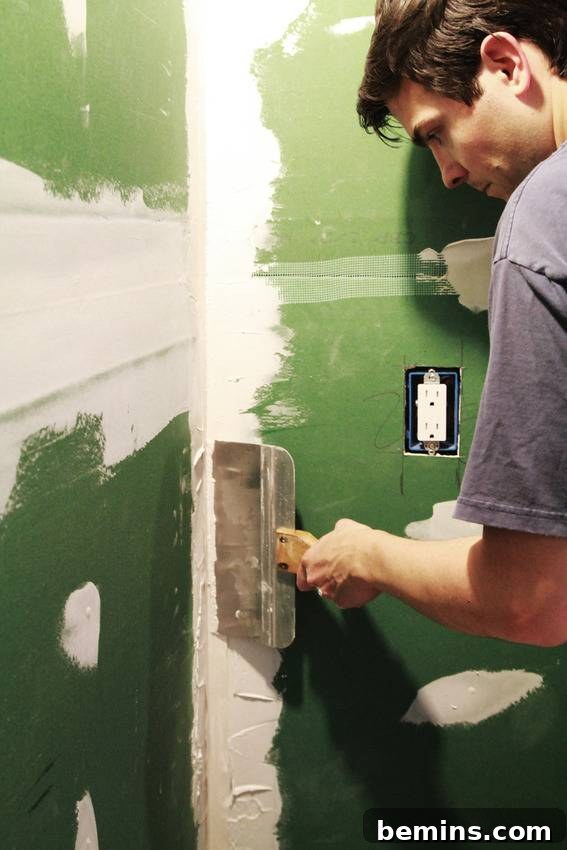 Applying Mud to the Green Board Walls