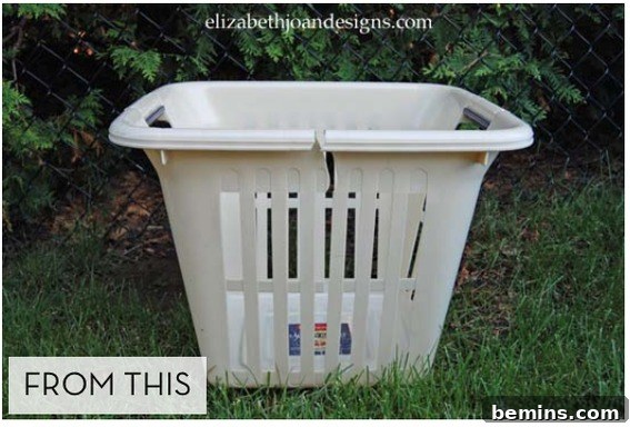 A white clothes basket sits outside near some trees.