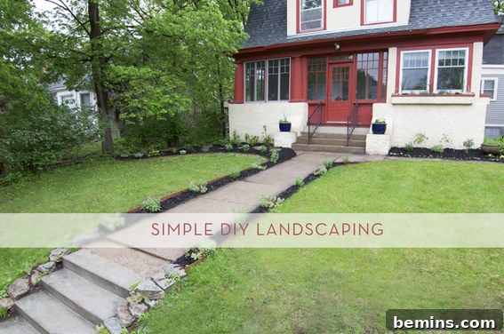 Landscaped yard with a charming red house
