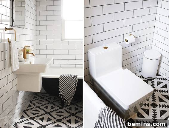 A Masterpiece in Design: A Restroom Showcasing a Stunning Combination of Black and White Tiles and Modern Fixtures