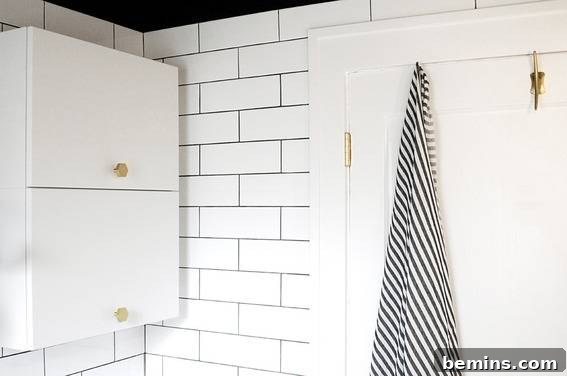 Cozy and Stylish: A Well-Designed Bathroom with Thoughtful Touches and a Black and White Towel