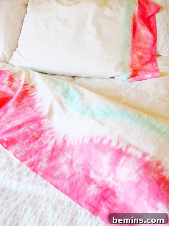 Tie-dye sheets and pillows in vibrant colors, bringing back a retro and stylish trend to your bedroom decor.