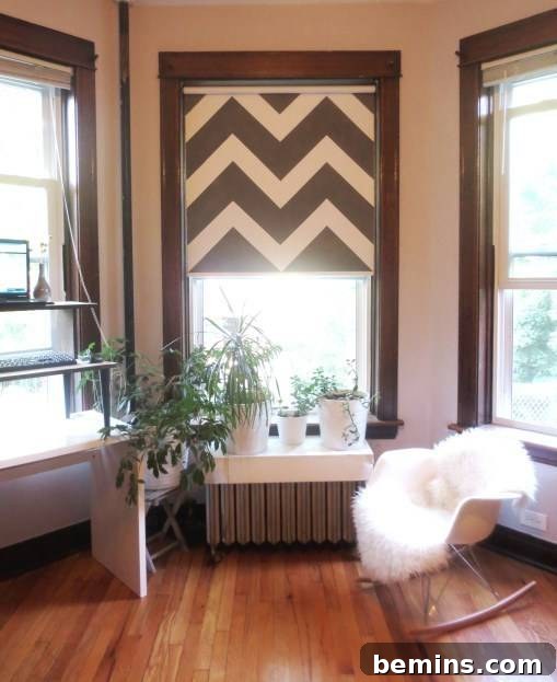 Interior view of a room having three windows and wooden floor.