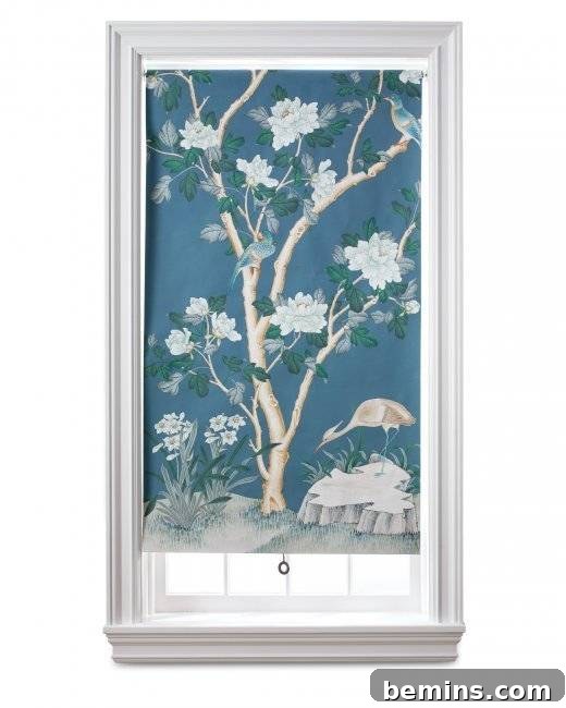 A window covered with a piece of cloth having a tree painted on it.
