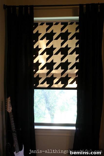Light coming in through a window with black and white curtains.