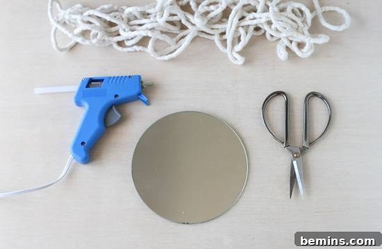 Turn a Plain Mirror into a Showpiece with this Braided DIY 3 Steel sheet, scissor, gun glue and thread is on white surface.