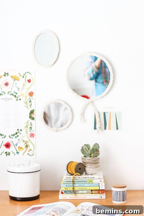 Turn a Plain Mirror into a Showpiece with this Braided DIY 8 The too of a desk, three small mirrors are on the wall.