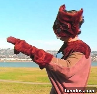A man in a furry costume and a squirrel emblazoned on his chest.