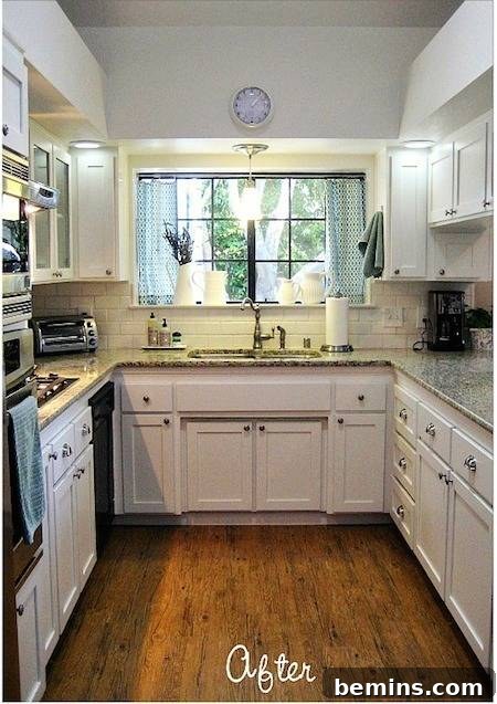 A bright and modern white kitchen with white cabinets - After the renovation