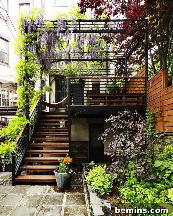 Backyard of the home along with steps and plants