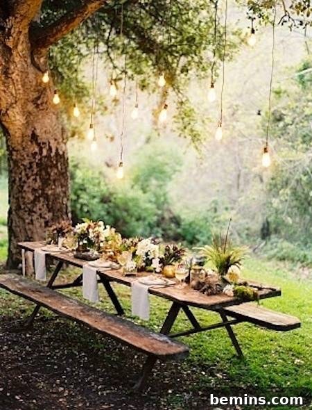 Outdoor Kitchen Dreams: 12 DIY Spaces to Inspire 12 A picnic table under a tree is ready for guests.