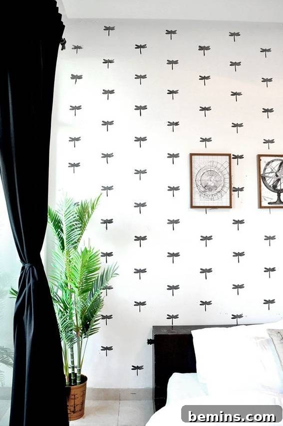 A plant is sitting in the corner of a room with a black and white wall paper.
